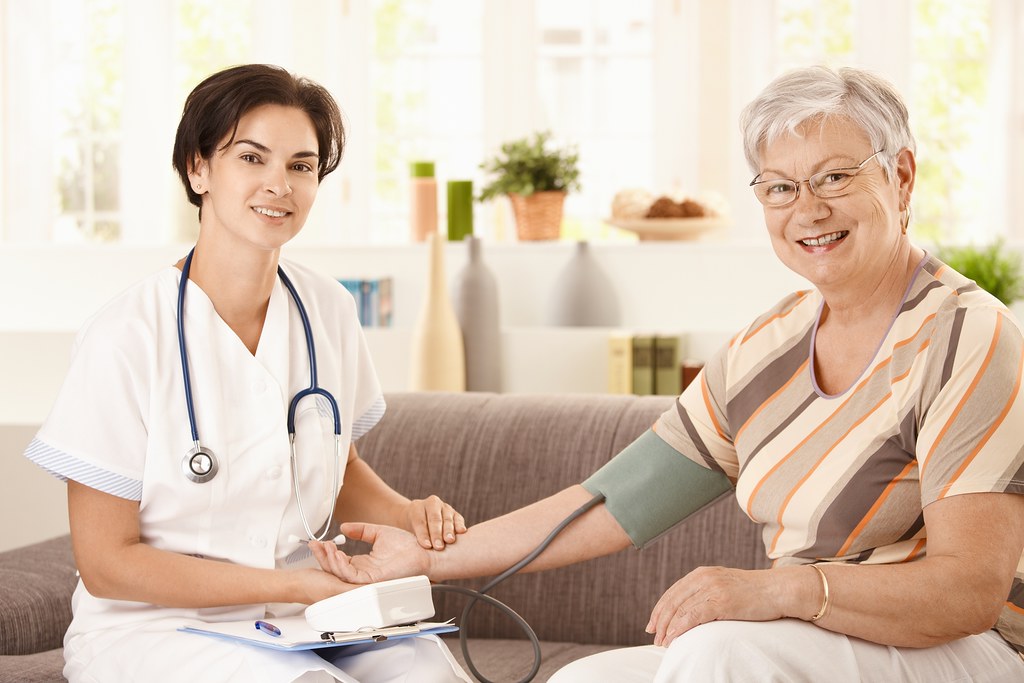A carer supporting an older person at home
